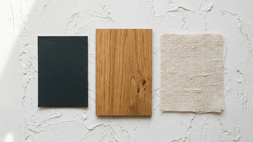 How to Style a Charcoal and Warm Wood Living Room Charcoal and warm wood color palette mood board with paint chip, oak veneer, and cream linen swatch.